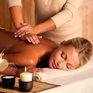 professional masseur doing massage of female back in the beauty salon